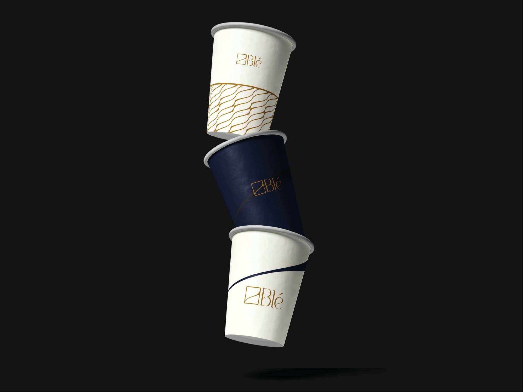 Branded takeaway cups in navy and cream