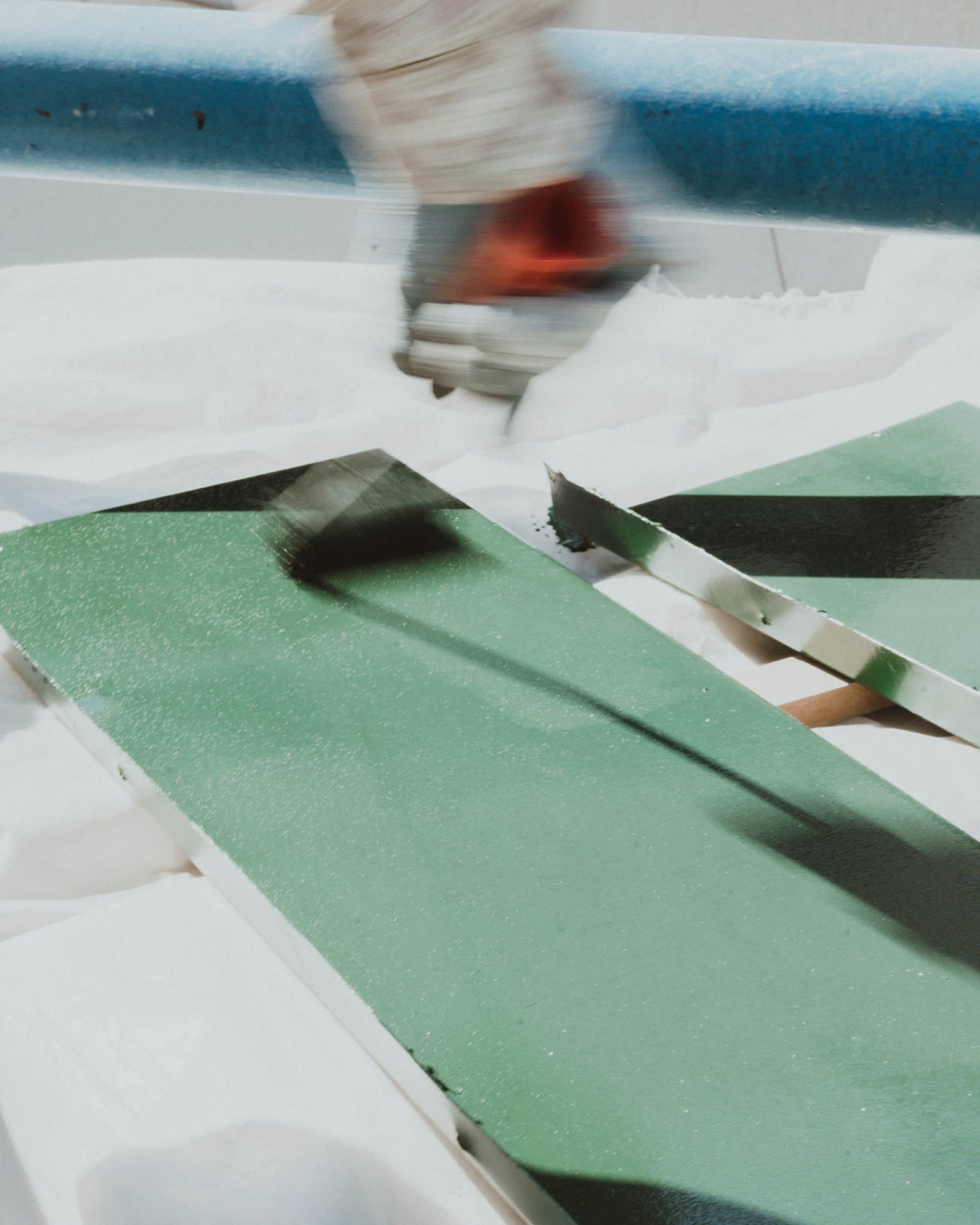 Pulling a print of the mascot by hand