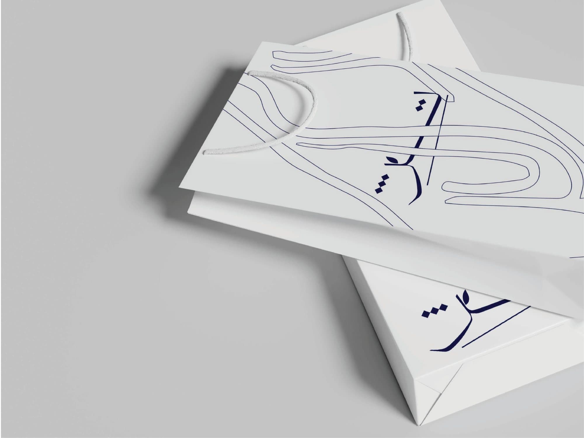 Tezh stationery showing the linear leaf motif